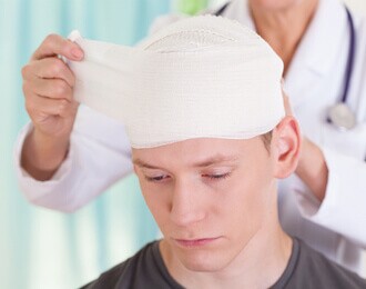 patient getting brain injury wrapped