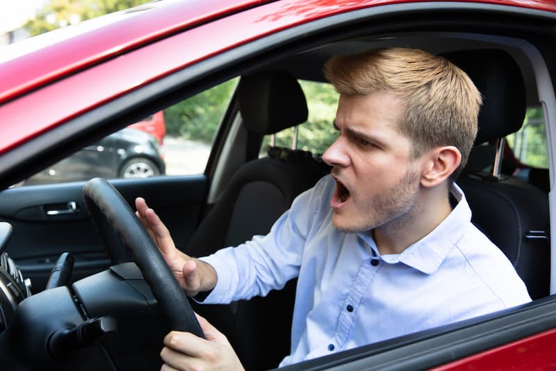 Angry driver pressing the horn