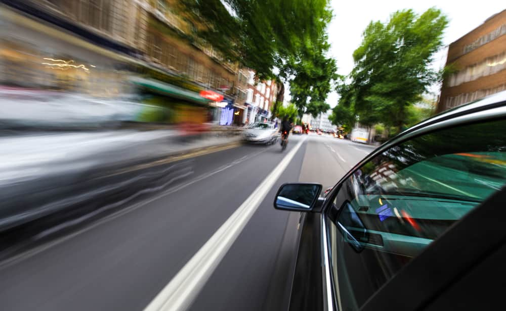 car speeding down downtown road