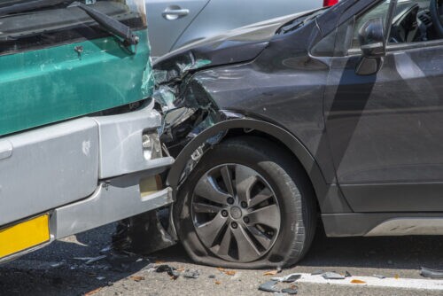 Collision between a city bus and a car