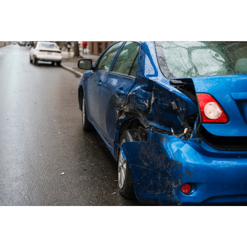 image of a car that has been hit on the side of the road