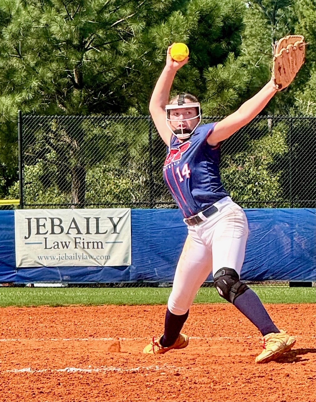 Addi Bescher winding up pitch on softball field