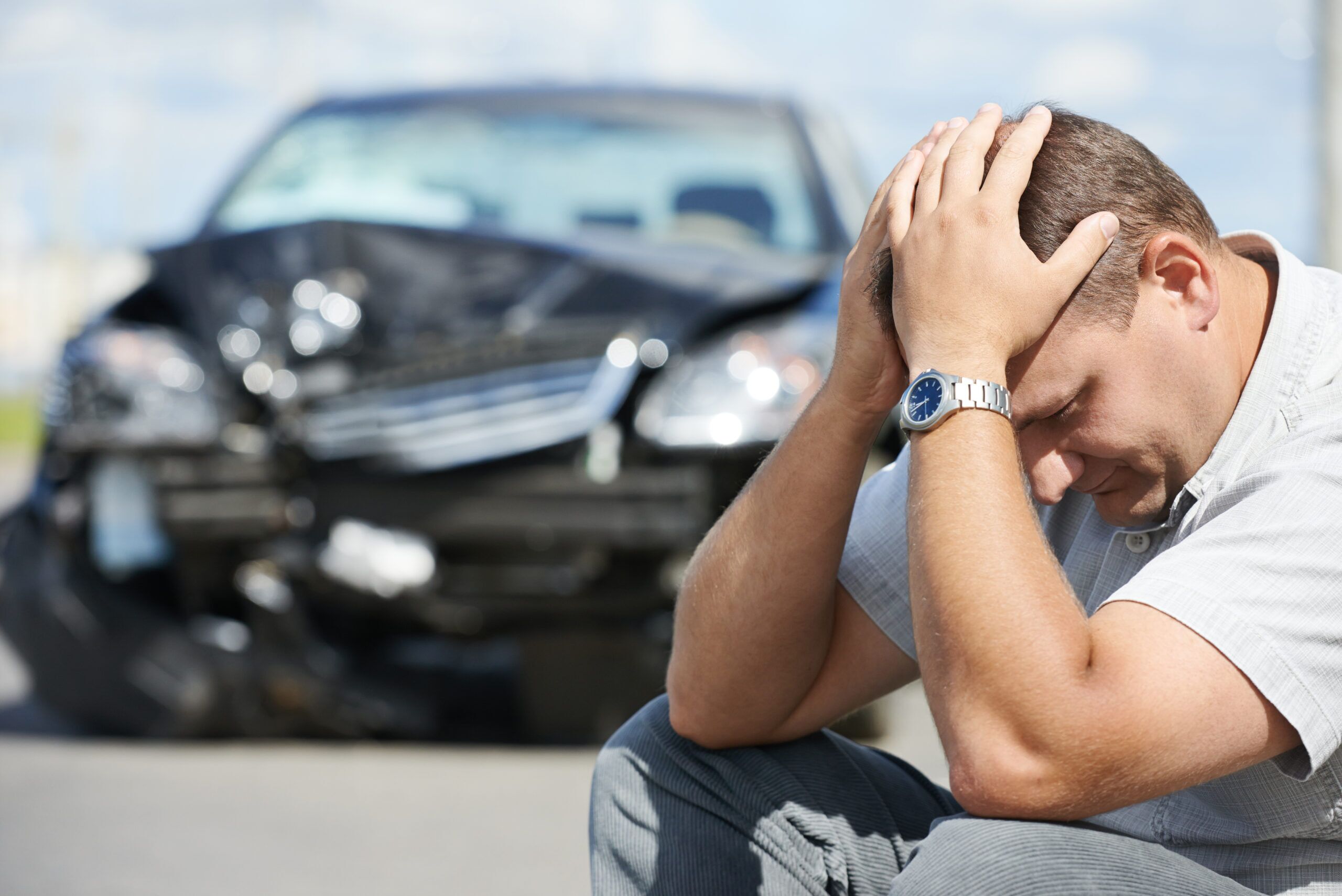 man with head in hands after hit and run