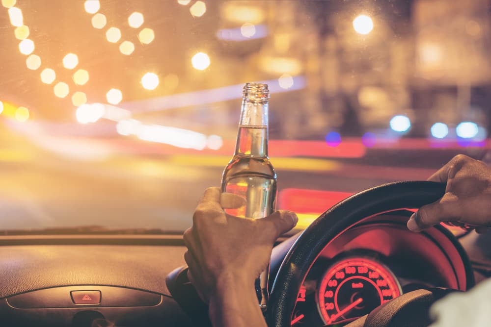 driver with a beer in hand while driving down business 17 in North Myrtle Beach