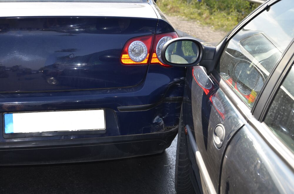 two cars involved in a sideswipe accident