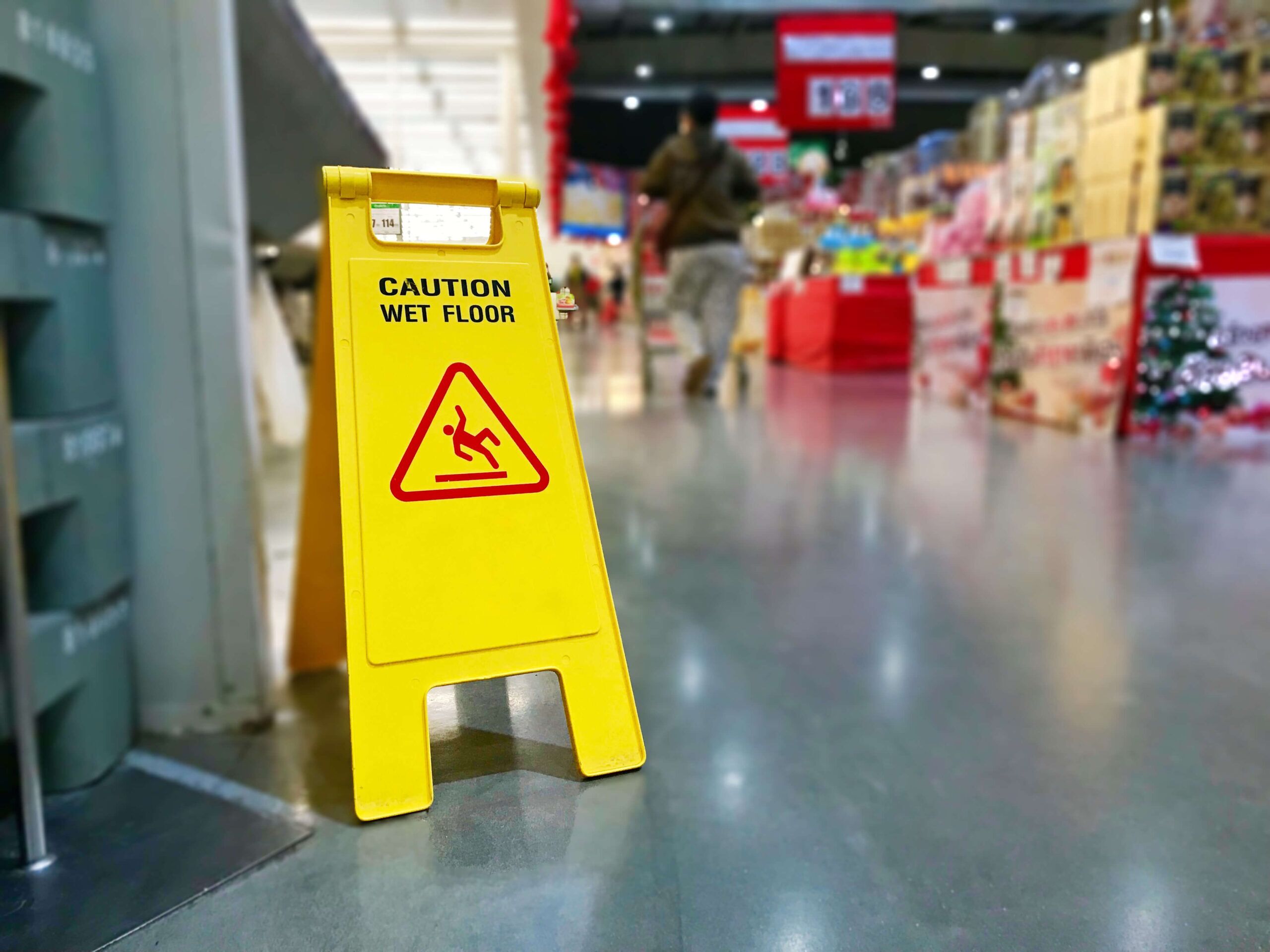 Warning label caution wet floor in the mall