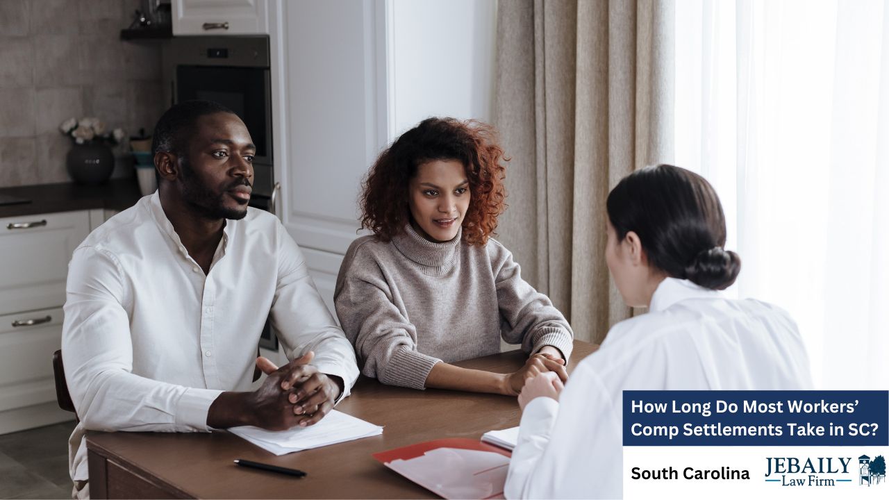A few people are sitting at a table, likely discussing or engaging in a conversation. The setting appears to be indoors, with visible clothing and human faces. The context relates to workers' compensation settlements in South Carolina, associated with the Jebaily Law Firm.