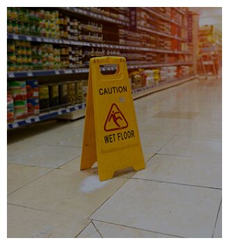 wet floor sign on premises of grocery store