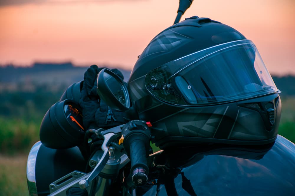 helmet on motorcycle; read more for reasons to wear one while traveling